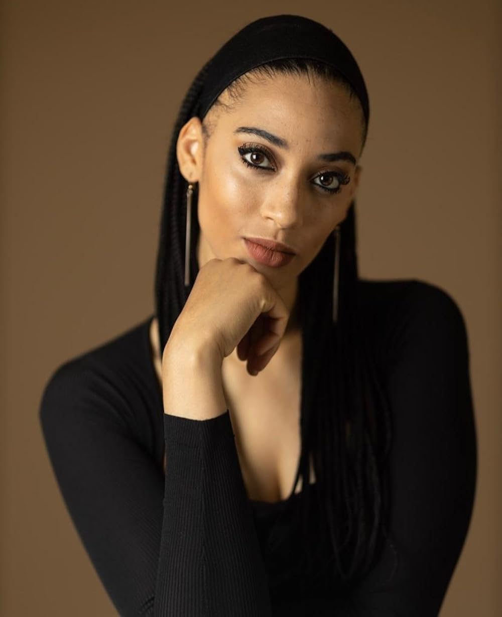 Sydney Duncan wearing black suit and pose for a pic